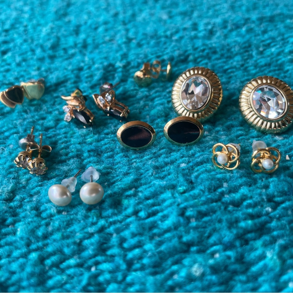 Lot of vintage gold tone, crystal earrings.Trifari